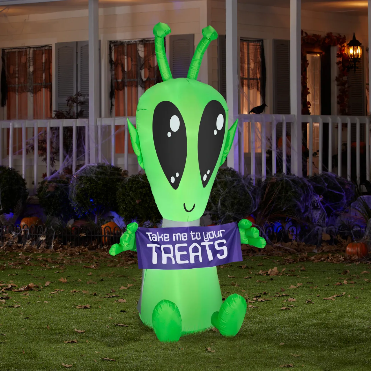 New National Tree Company 7 ft. Halloween Alien with Sign Inflatable Decoration with LED Lights
