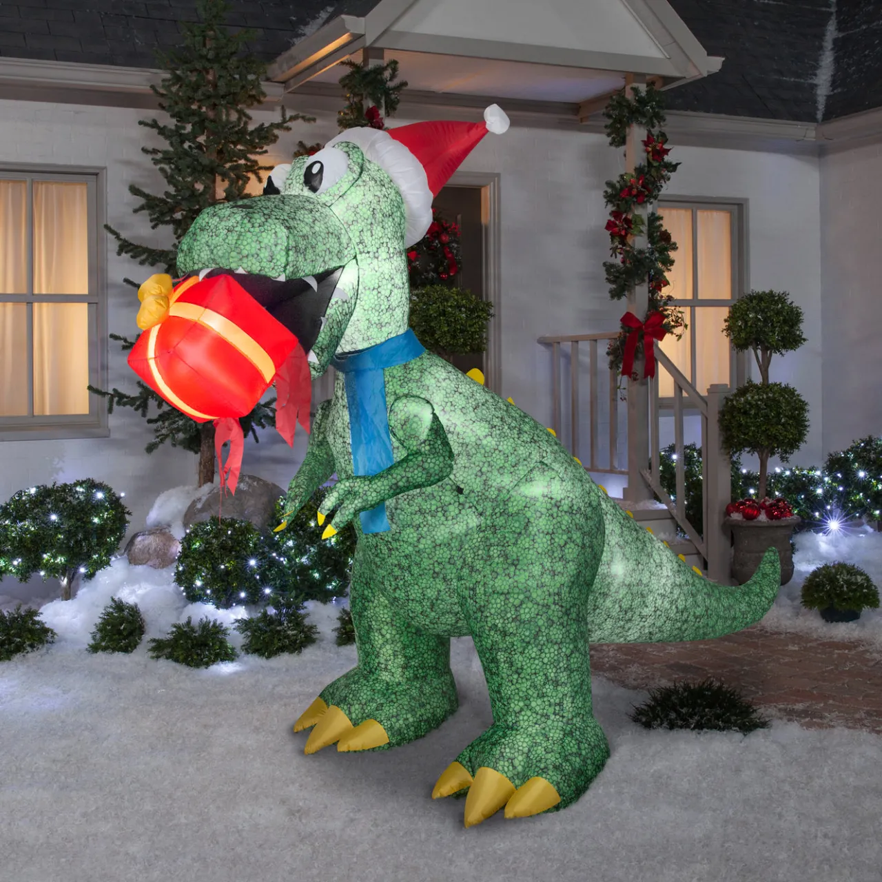 Best National Tree Company 9.5 ft. Inflatable Tyrannosaurus Rex with Gift and LED Lights