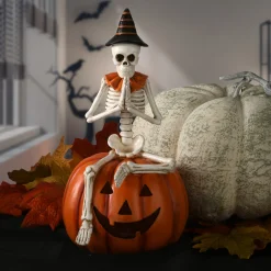 New National Tree Company 12 in. Halloween Trick or Treat Skeleton on Jack O Lantern with LED Lights