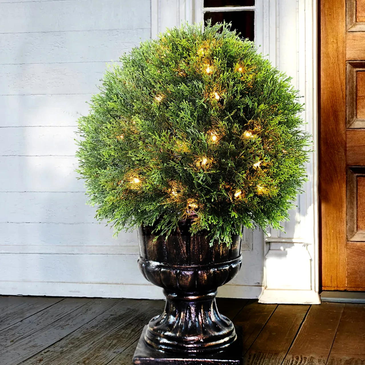 Best National Tree Company 27 in. Pre-Lit Upright Juniper Ball Topiary Tree in a Decorative Urn with Clear Lights