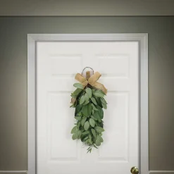 National Tree Company 26 in. Spring Teardrop Wall Hanging Decoration with Eucalyptus Leaves, Magnolia Blooms, Flowing Green Stems