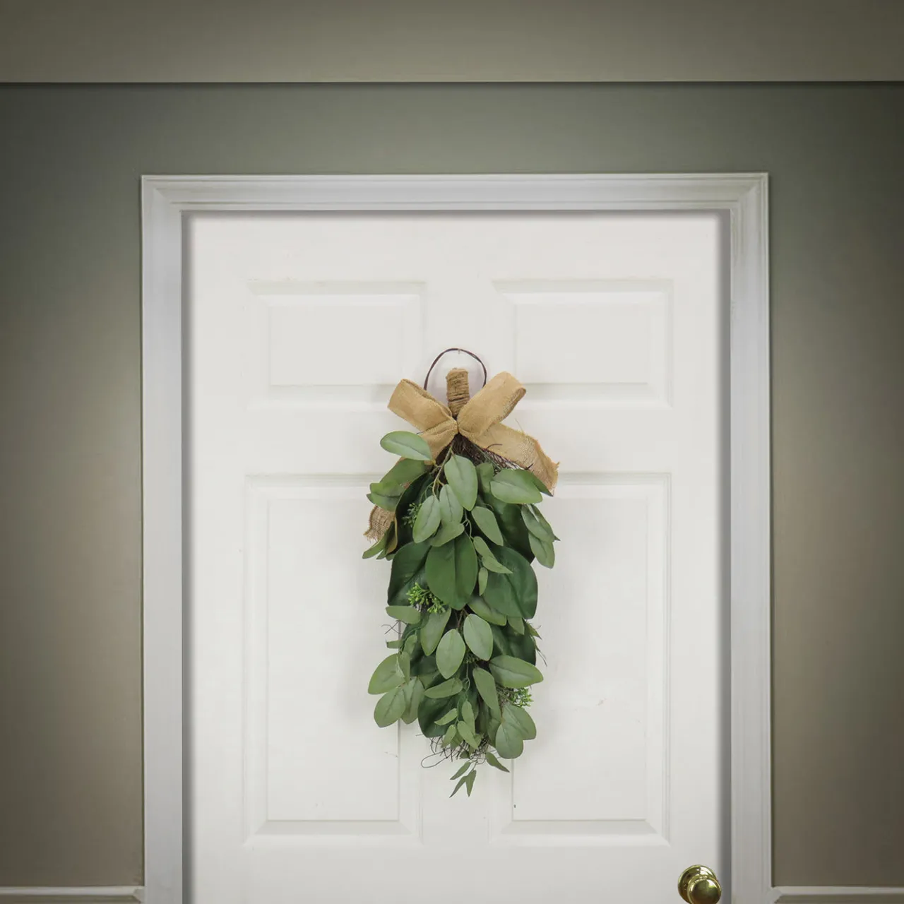 National Tree Company 26 in. Spring Teardrop Wall Hanging Decoration with Eucalyptus Leaves, Magnolia Blooms, Flowing Green Stems